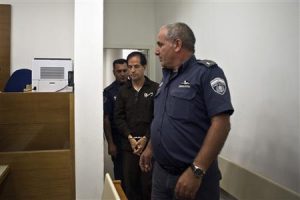 Iranian-Belgian citizen Mansouri enters a courtroom at the magistrate's court in Petah Tikva